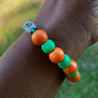 FAMU QUEEN 👑🧡💚 GLOW IN THE DARK ALPHABET BRACELET🐍🐍🧡💚 READY-MADE🎨⏳️ By Nubian Collection Artwear 👑 - Thumbnail 4