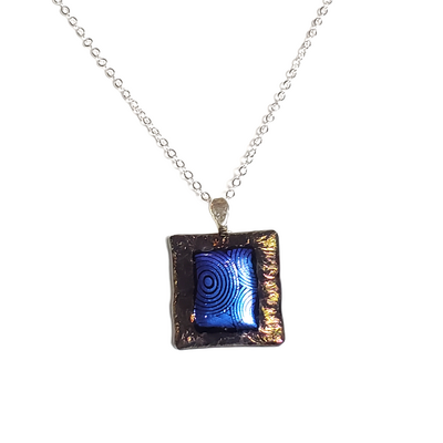 Dichroic blue circles on metallic black fused glass necklace