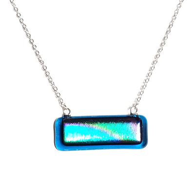 Dichroic rainbow on transparent blue fused glass bar necklace